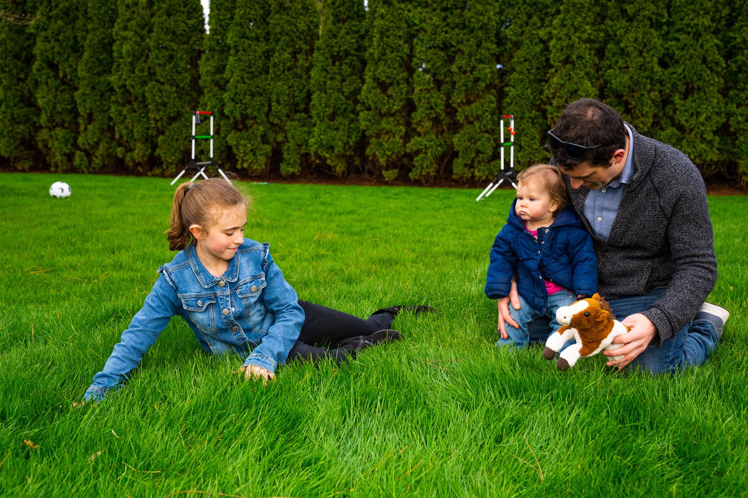 lawn care family playing in grass