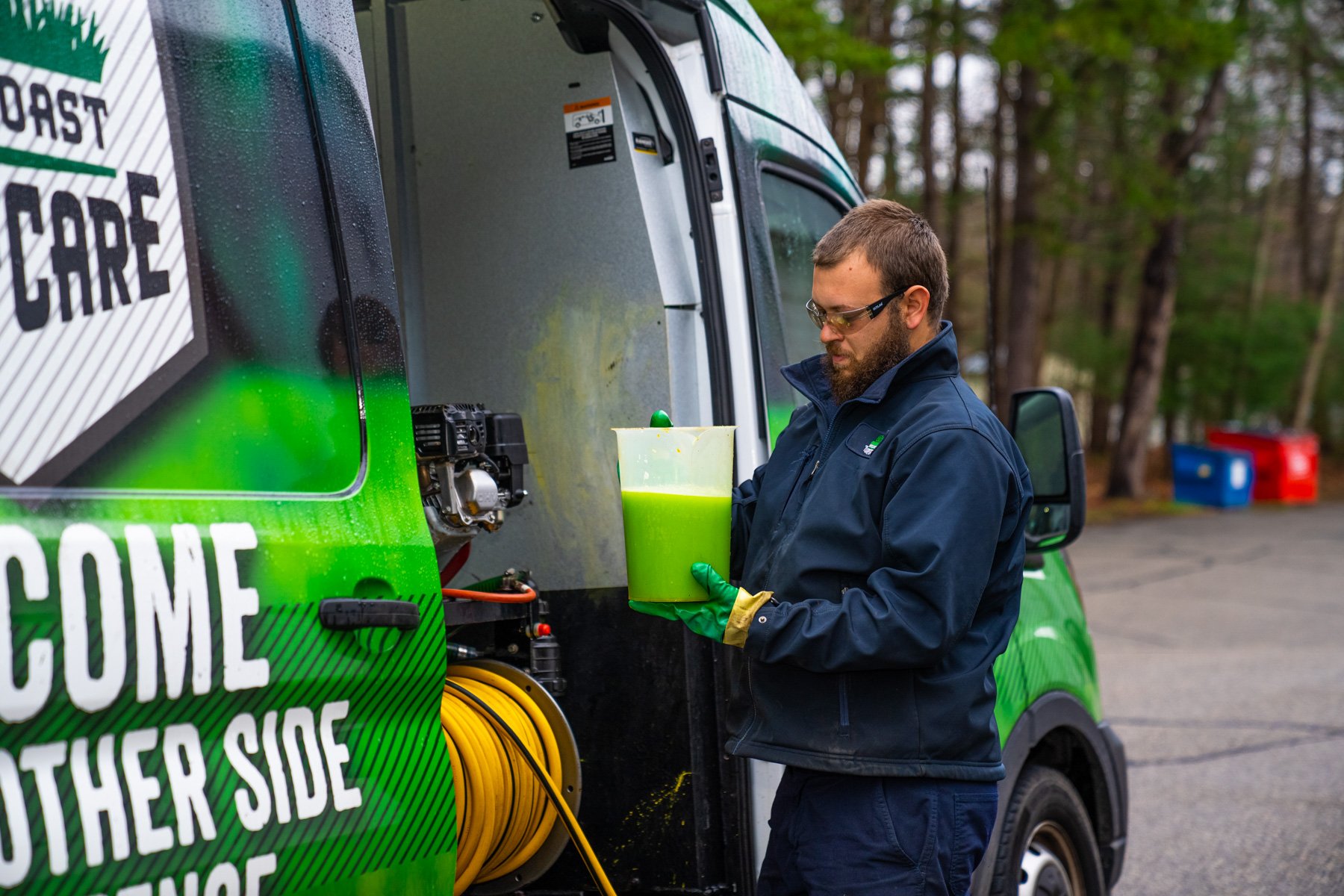 lawn care technician mixing fertilizer