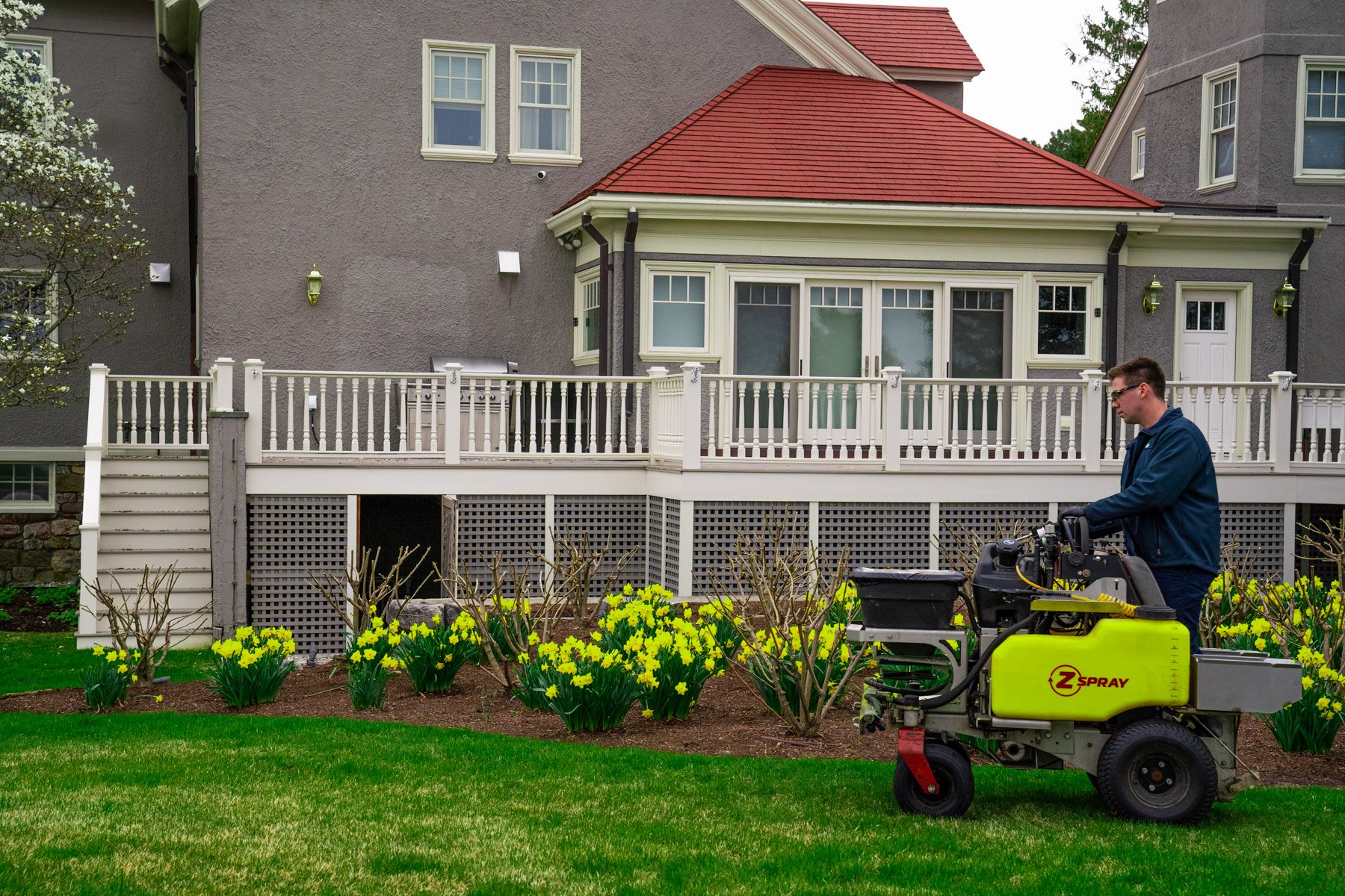 lawn care technician treating 2