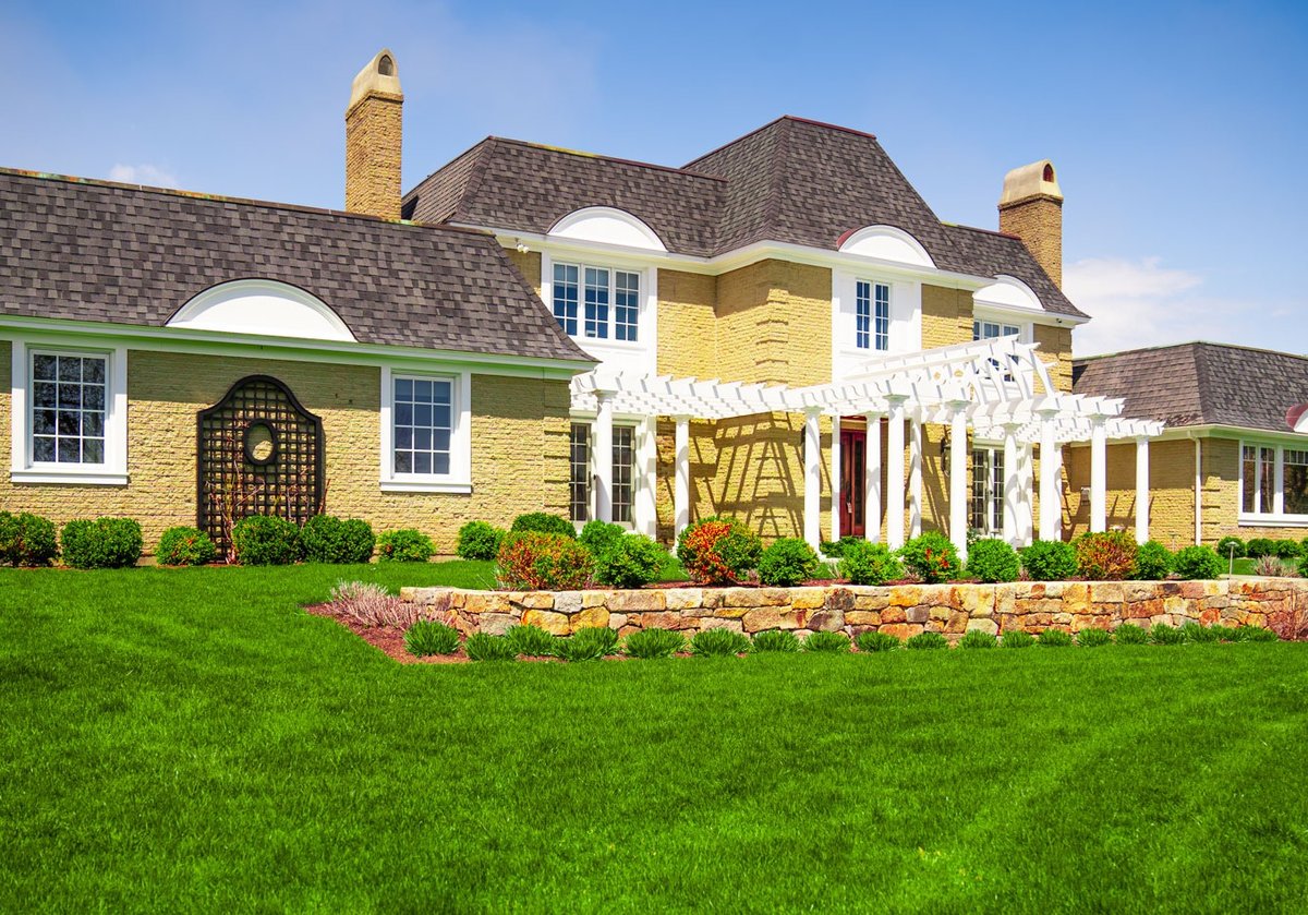 home with well maintained grass and landscape