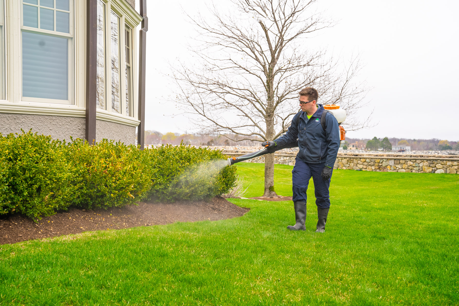 mosquito control being applied to a new england home