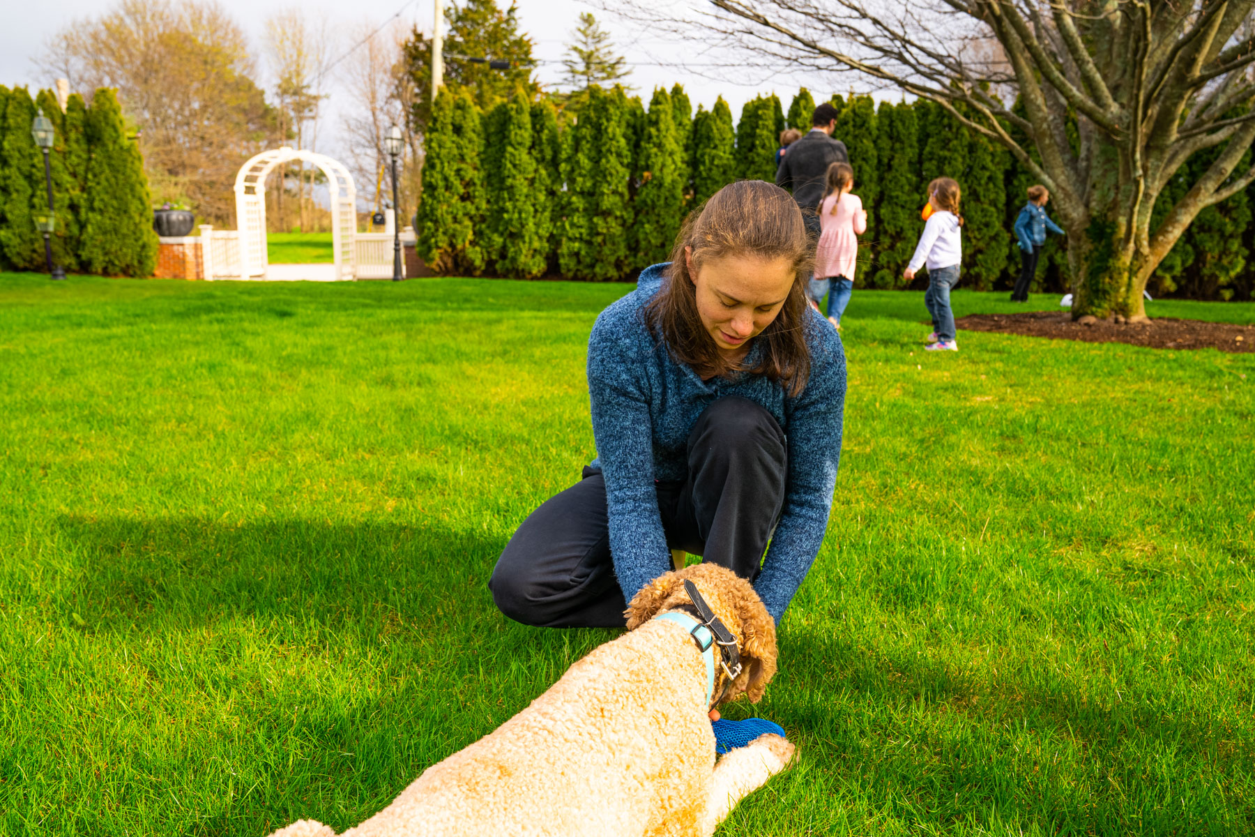 Woman and dog in yard